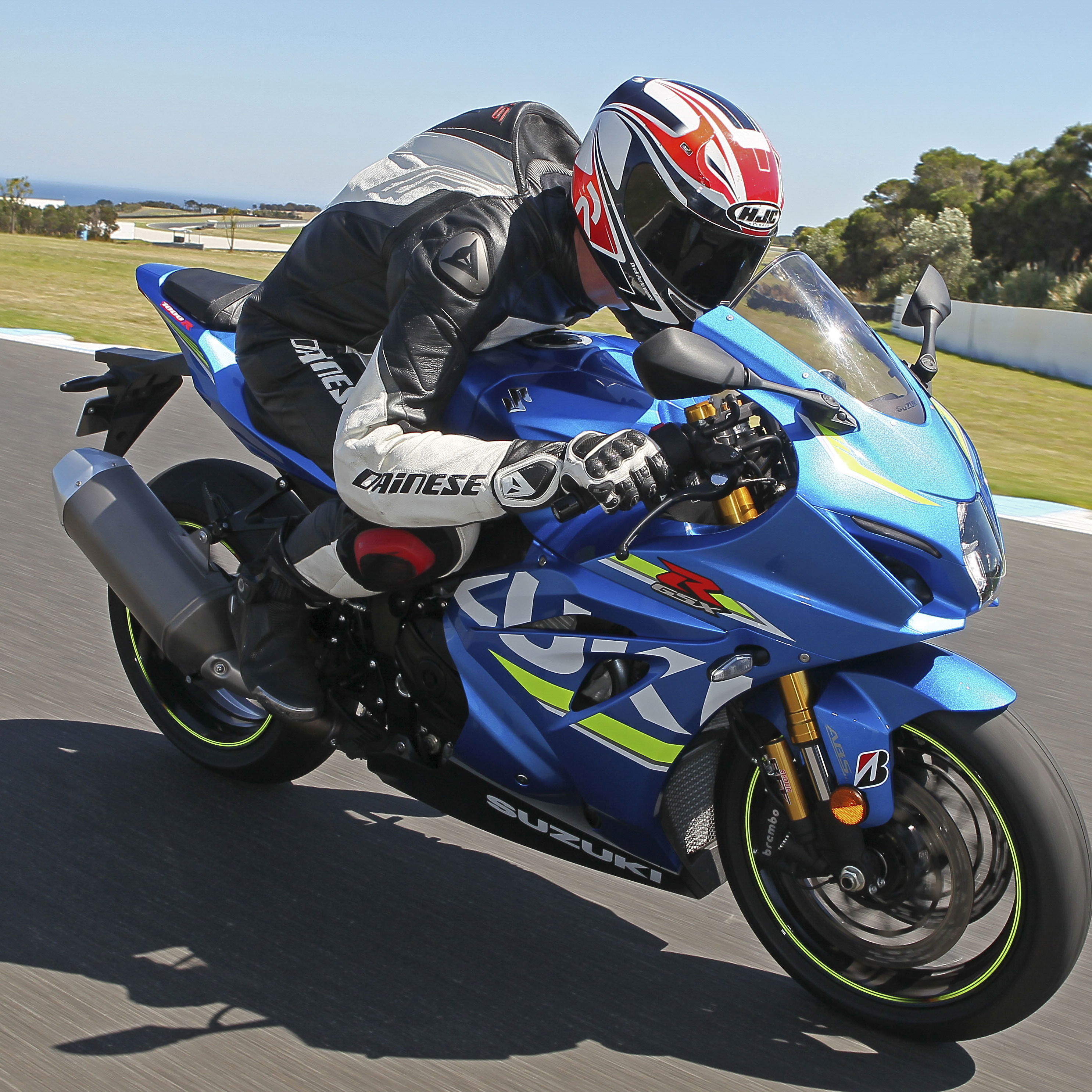 A blue 2017 Suzuki GSX-R1000R being ridden on a track